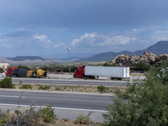 truck parking lot in Arizona. rocks and mountains