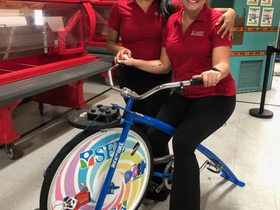 Students posing with a lab bike.