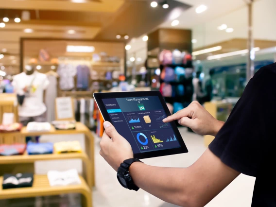 Retail staff working on a tablet.